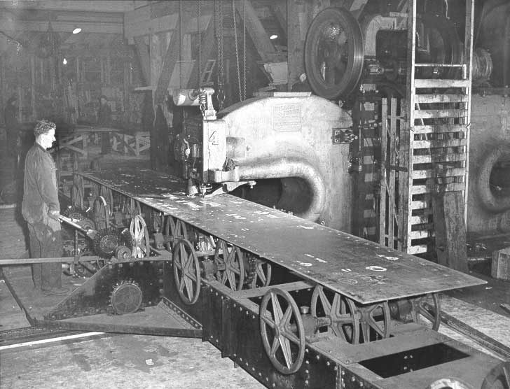 Prince Rupert shipyard : mammoth punch press punching steel plate for cargo vessel