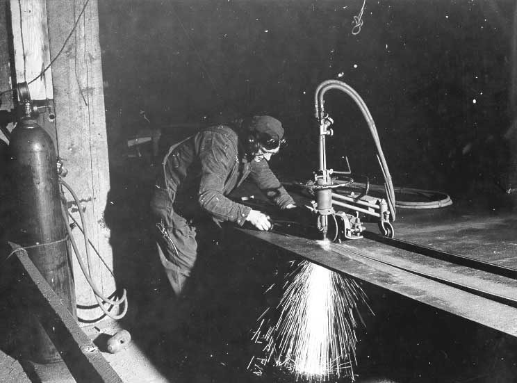 Prince Rupert shipyard : torches are used for cutting steel plates