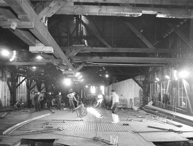 Prince Rupert shipyard: on “slab”, white-hot steel girder is bent to shape