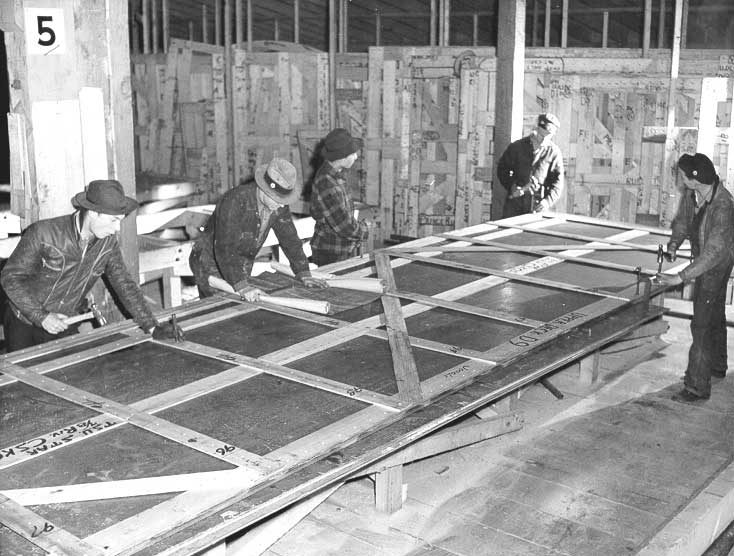Prince Rupert shipyard : patterns laid on steel plate to mark hole locations for drilling