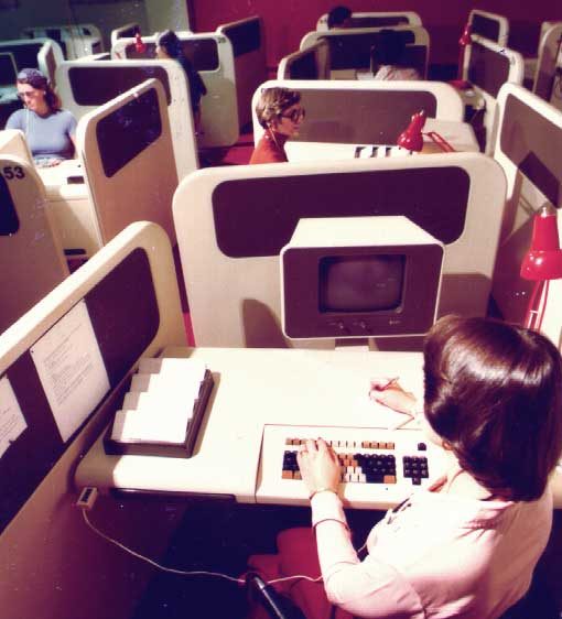 Telephone operators working at new computer workstations in the Gander Exchange building