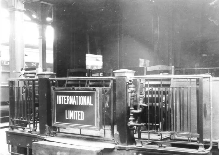 Train International Limited drumhead on the rear platform of an open observation car