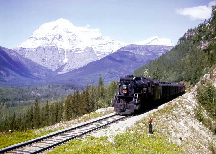 A steam passenger train in the Rockies