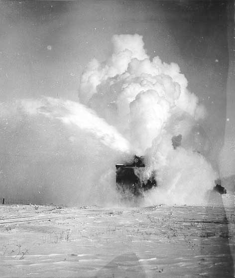 A steam-powered rotary snowplough at work