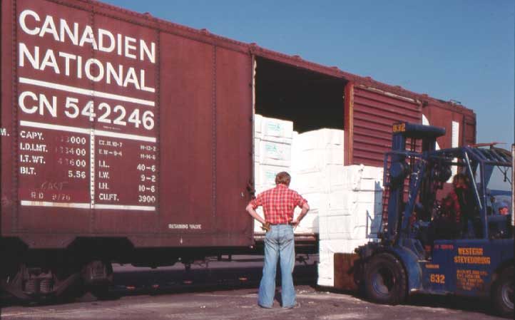 Unloading packaged lumber from a boxcar