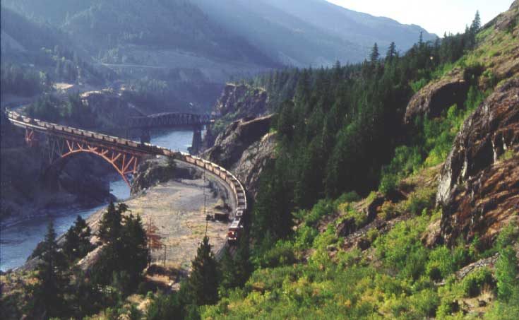 Freight train crossing the Cisco Bridge on the Fraser River
