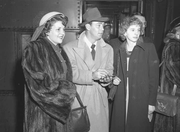 Actor Alan Ladd signing an autograph