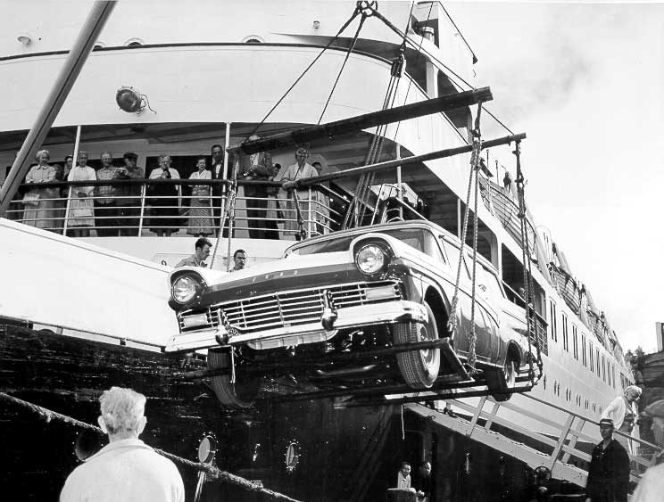 Unloading a Ford station wagon from passenger ship CNSS Prince George