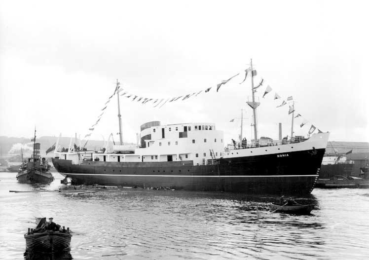 Launching of the Newfoundland coastal ship MV Nonia with tug Danny in the background
