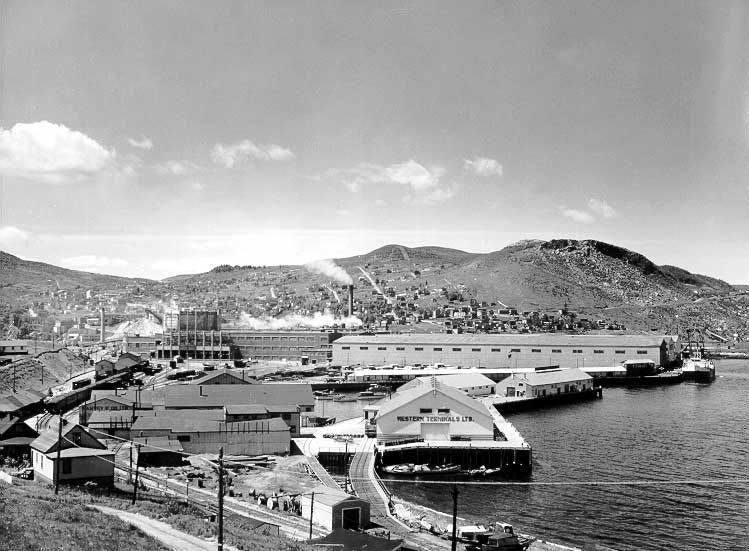 Nfld. Ry. freight terminal with Corner Brook Pulp and Paper Limited in behind