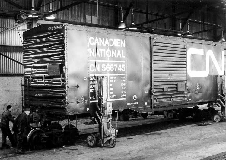 Changing between standard and narrow gauge trucks in a transfer shed using the Towveyor System