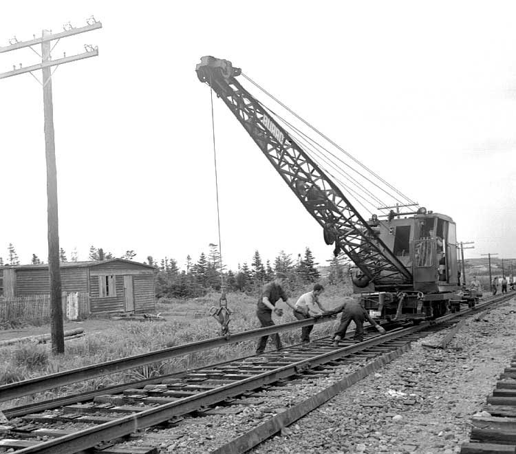 A track-laying machine laying track for the Nfld. Ry.