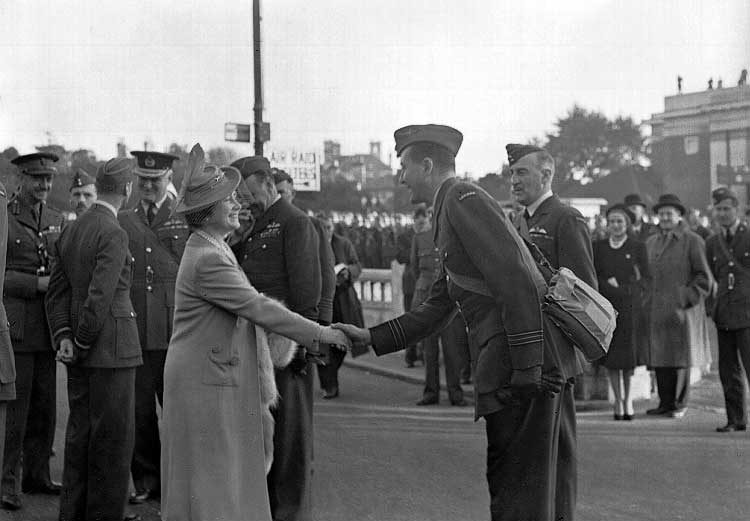 Officer commanding the Canadian section of a Personnel Reception Centre is presented to the Queen