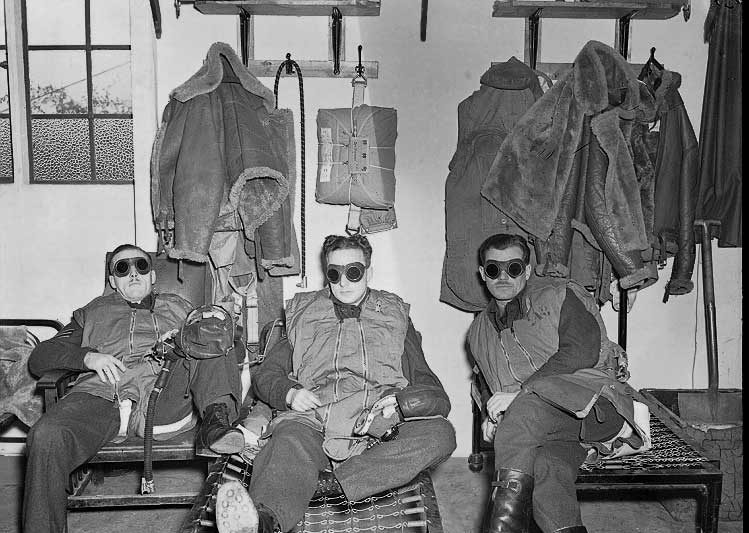RCAF night fighter pilots wait in their dispersal huts wearing goggles to adjust their eyes to dark