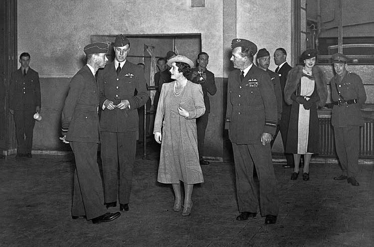 King George VI and Queen Elizabeth inspect the airmen's mess during afternoon tea