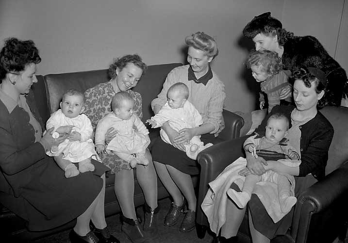 Five women and their babies, families of RAF members stationed in Canada, wait to depart for England