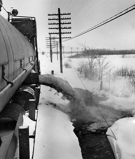A snow melter in operation releases melted snow
