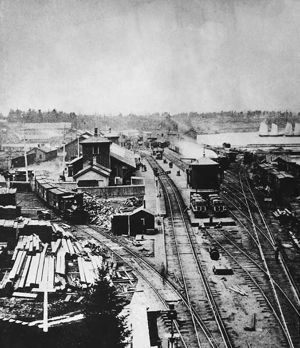 GWR's Hamilton yards and station with locomotive shops, grain elevators and distant sailing schooners