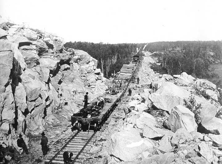 Grand Trunk Pacific Railway tie train installing ties 117 miles east of Winnipeg