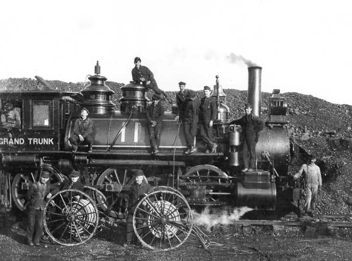 Grand Trunk Pacific Railway Company volunteer fire brigade pose with equipment on locomotive no. 11
