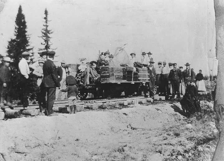 First train into The Pas: railroad employees and passengers with luggage