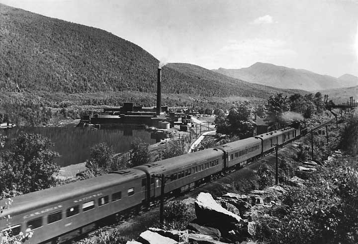 Canadian National Railways passenger train no. 16 passing the Brown Brothers Plant along the Montréal to Portland line
