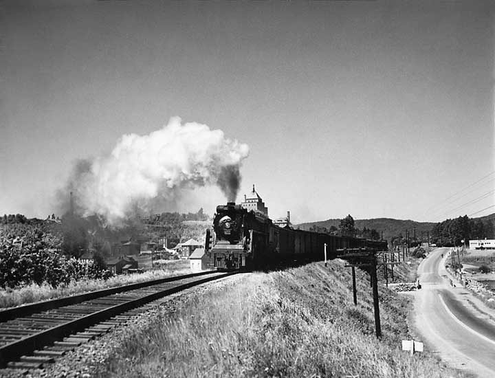 Canadian National Railways steam locomotive no. 6162 hauls an eastbound passenger train extra through the Maritimes