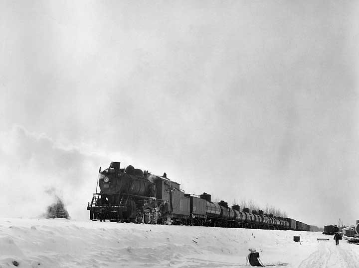 A train carrying supplies for construction of the Moak Lake line