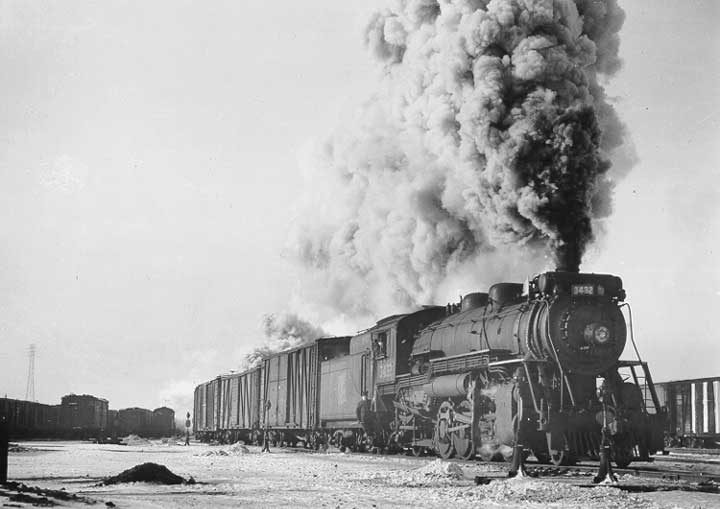 Canadian National Railways steam locomotive no. 3432 hauls a freight train