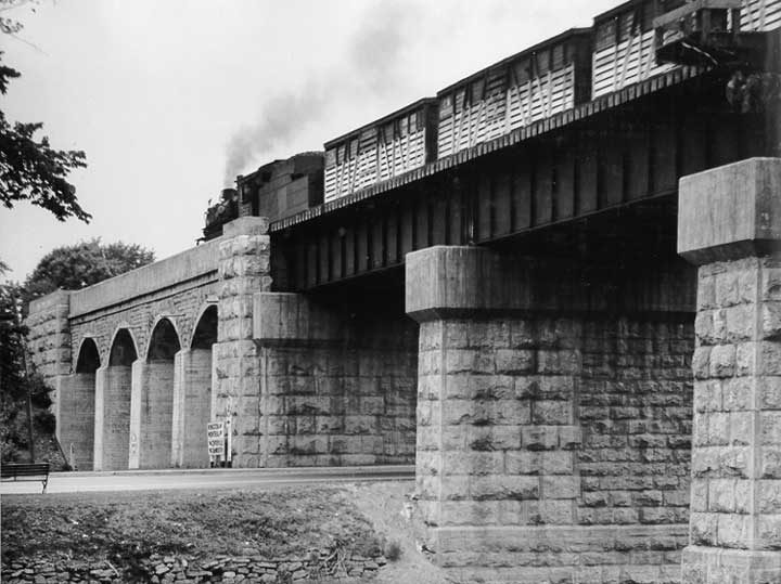A Canadian National Railways freight train on a bridge over the Napanee River