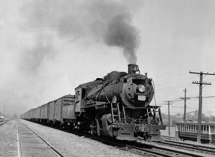Canadian National Railways steam locomotive no. 8297 hauls a freight train near Montréal