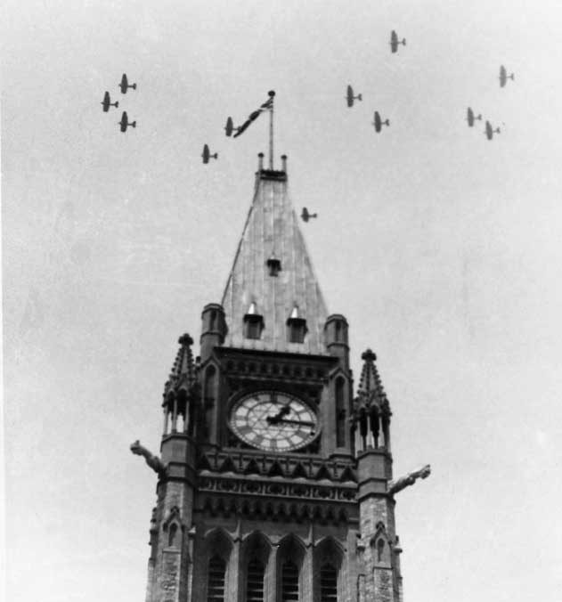 A fly past over the Peace Tower to honour the Diamond Jubilee of Canada's Confederation