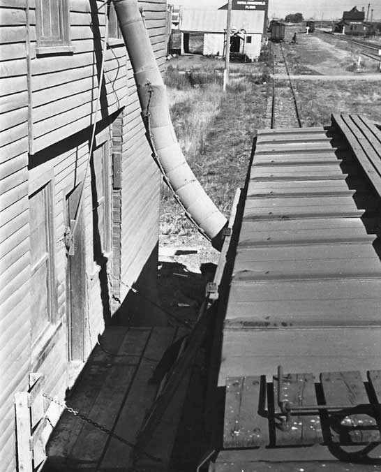 Grain being loaded from grain elevator onto freight car