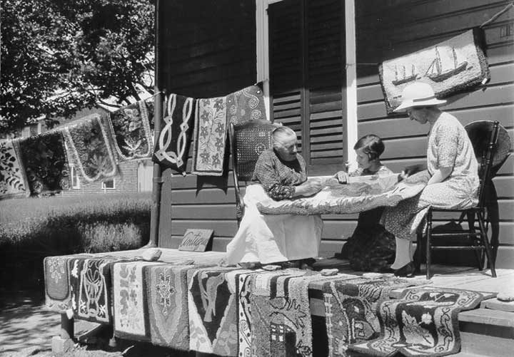 Women selling home crafted rugs