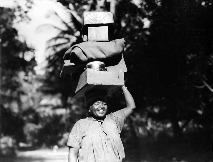 East Indian woman carrying a heavy load