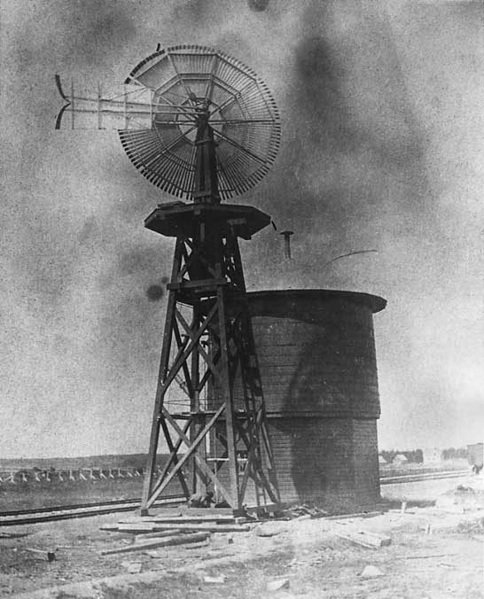 Water tank and windmill-operated pump