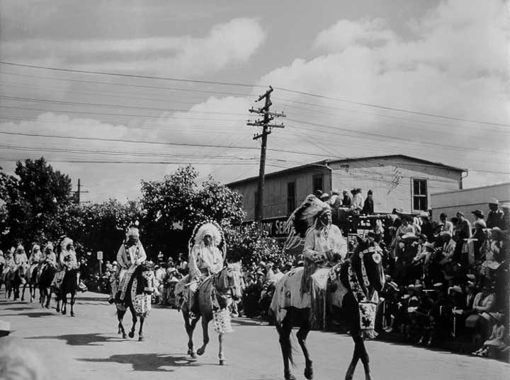 Aboriginal riders in full regalia participate in parade for Calgary Stampede
