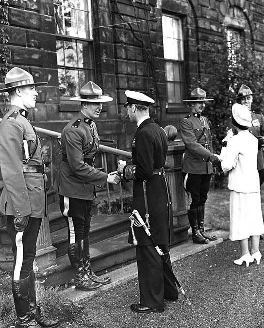King George VI and Queen Elizabeth speak with members of the Royal Canadian Mounted Police during their 1939 Royal Tour of Canada