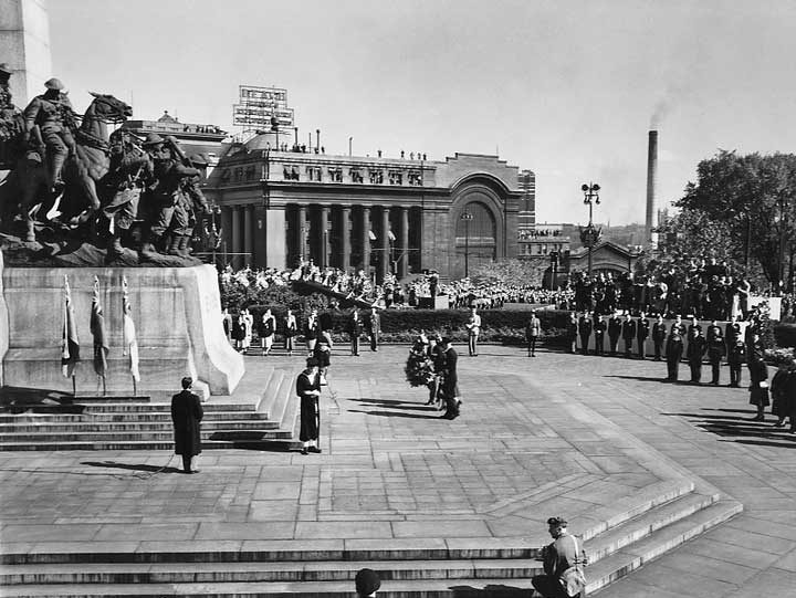 Wreath-laying ceremony at the National War Memorial attended by Princess Elizabeth and the Duke of Edinburgh during the 1951 coast-to-coast Royal Tour of Canada