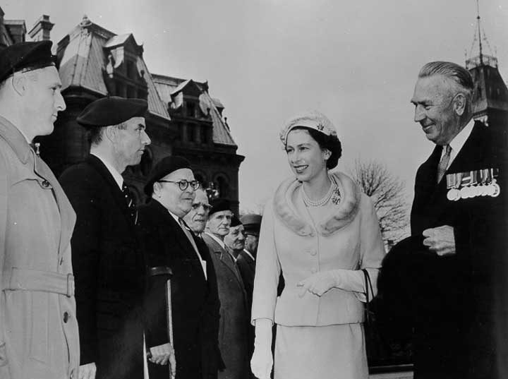 Queen Elizabeth inspects an honour guard of Veterans at a ceremony in Ottawa during the 1957 Royal visit