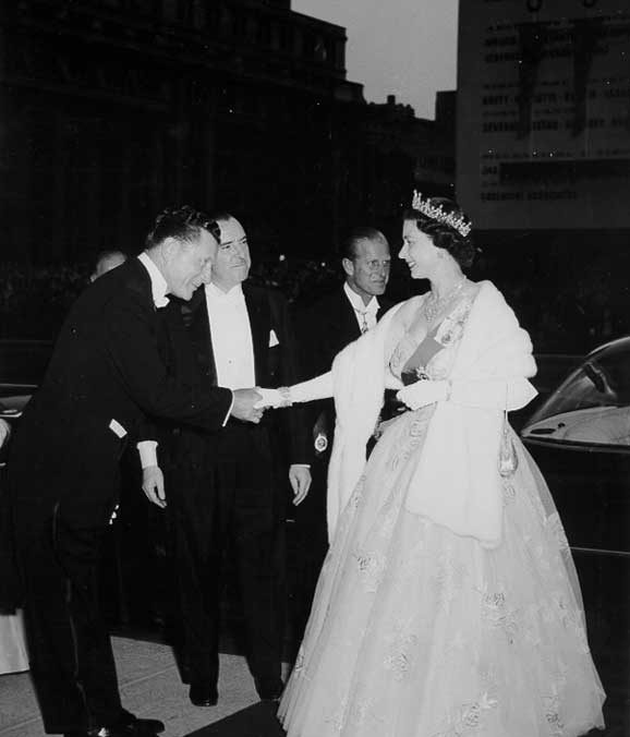 Queen Elizabeth and Prince Philip disembark from their limousine during the 1959 Royal Tour of Canada