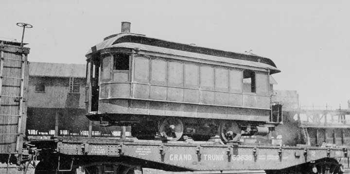 A Grand Trunk Railway flat car carrying a street railway car