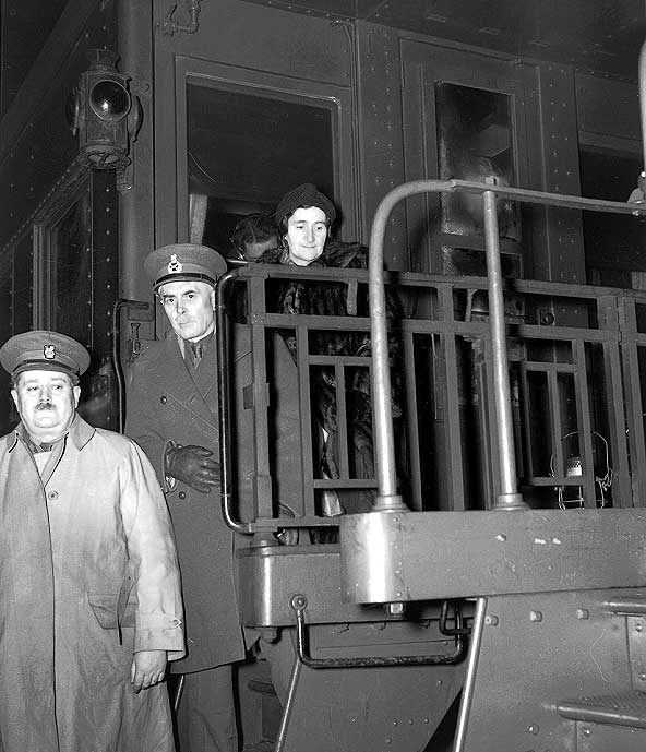 Lt. General and Mrs. McNaughton and Major J.C. Murchie boarding special train at Halifax