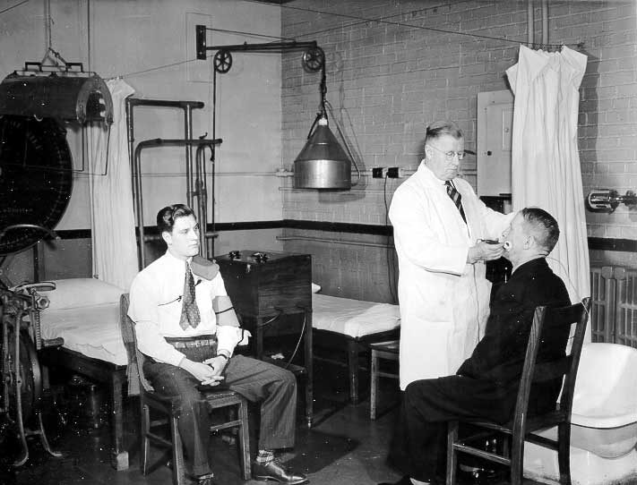 Doctor examining patients at the medical department clinic, Montreal