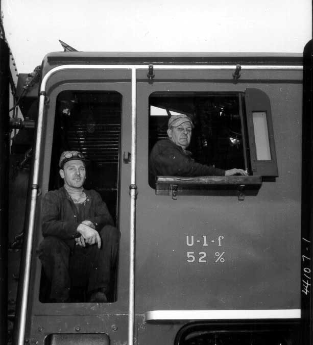 Employees aboard steam locomotive no. 6060