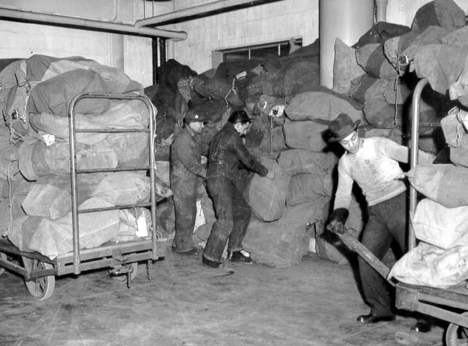 Sorting bags of Christmas mail at Montreal's Central Station