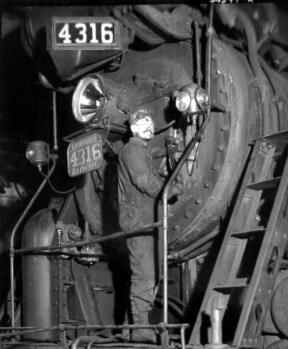 CN employee working on locomotive 4316