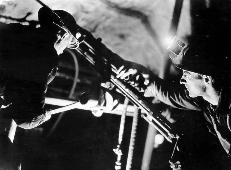 Two miners deep inside a Northern Ontario mine
