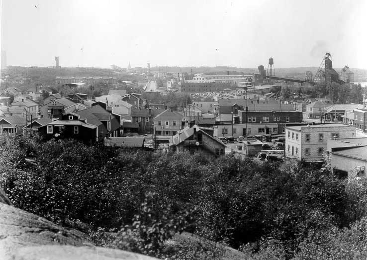 Town of Kirkland Lake including Lake Shore Mine, centre, Teck Hughs Mine, Centre background, and Kirkland Lake Gold Mine, left