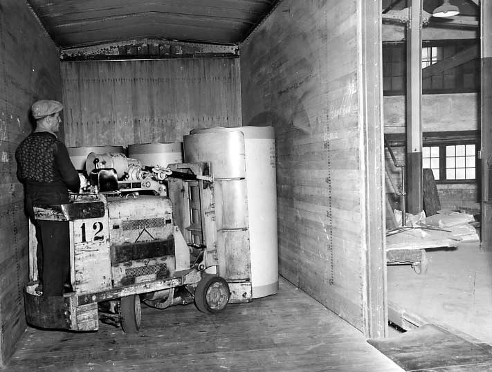 Loading paper into a CNR freight car at the Consolidated Paper Co.